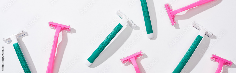 flat lay with green disposable razors on white background flat lay with green disposable razors on white background