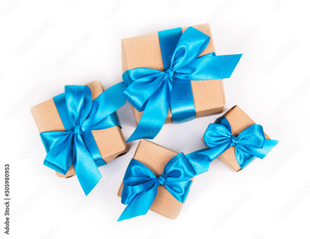 Gift boxes on white background. Gifts with blue bows. Gift boxes top view