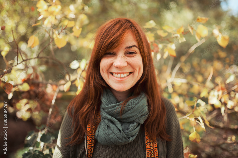 Young woman portrait looking at the camera in the forest Young woman portrait looking at the camera in the forest