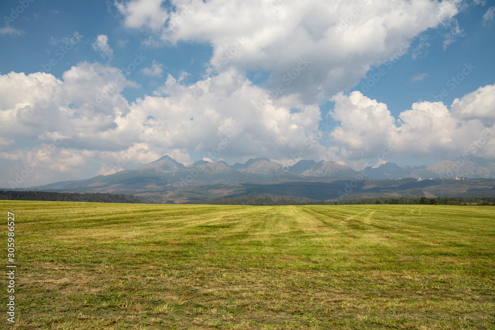 Beautiful landscape with mountains over field Beautiful landscape with mountains over field