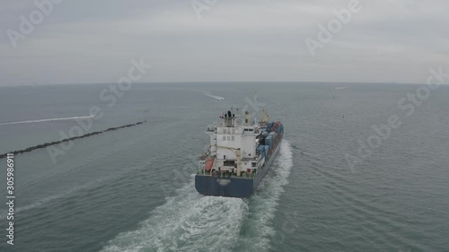 Follow Cargo ship goes to the open ocean.