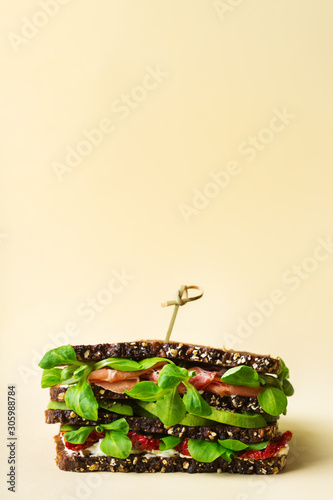 Fresh rye bread sandwich with ham  lettuce and tomato