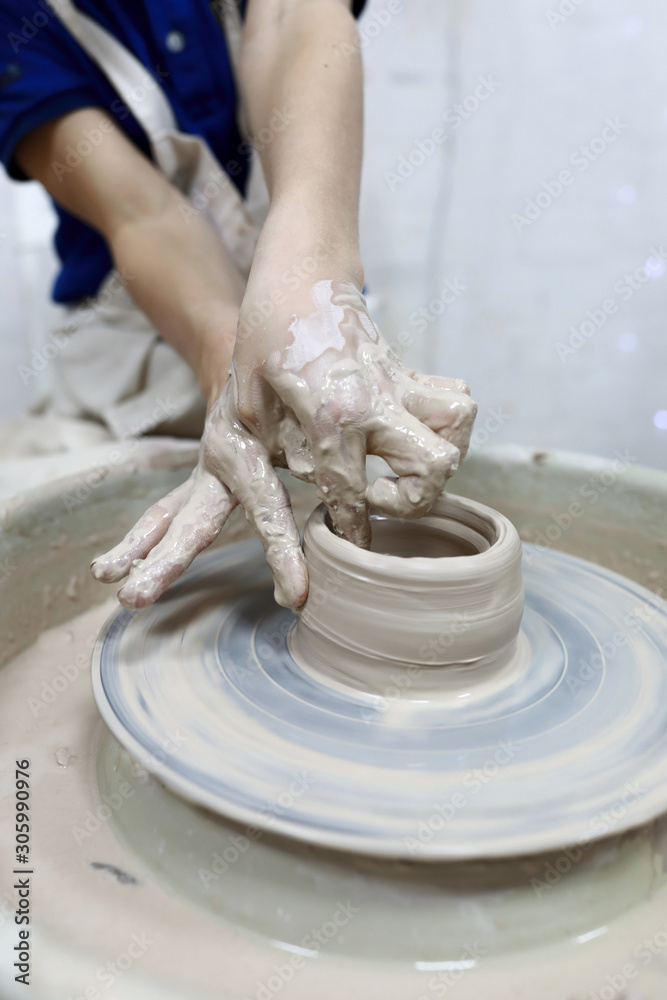 Boy hands making in clay
