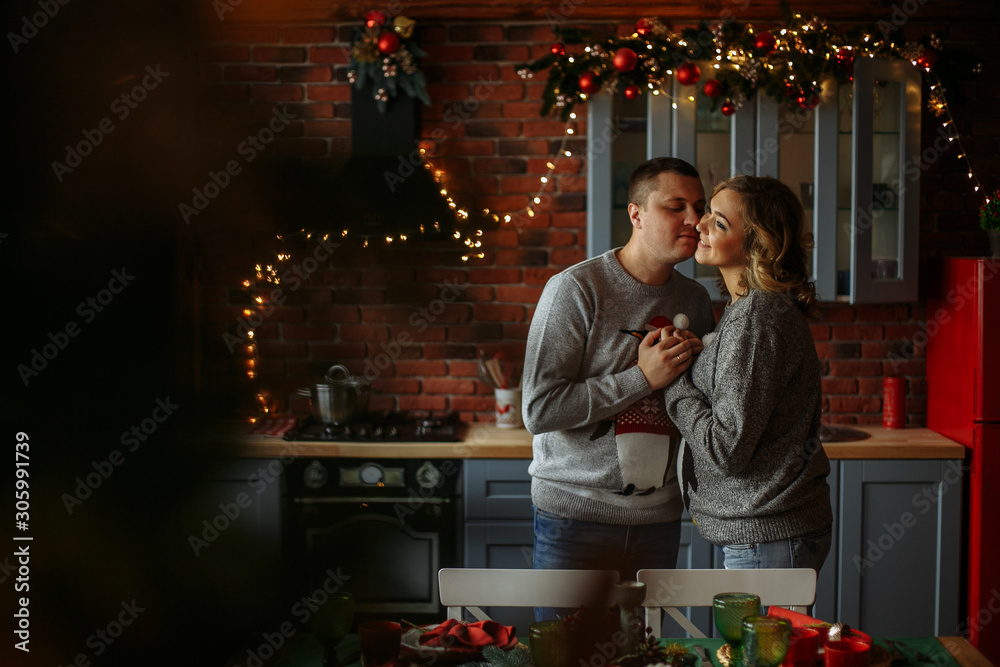 kisses in the kitchen. christmas morning
