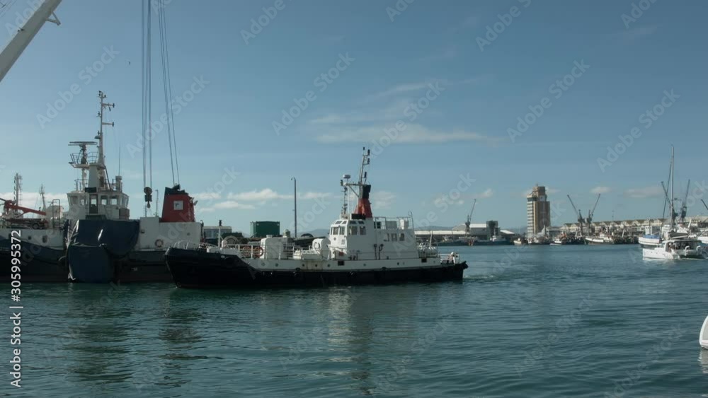 small ship is on unloading in the port of Cape Town small ship is on unloading in the port of Cape Town