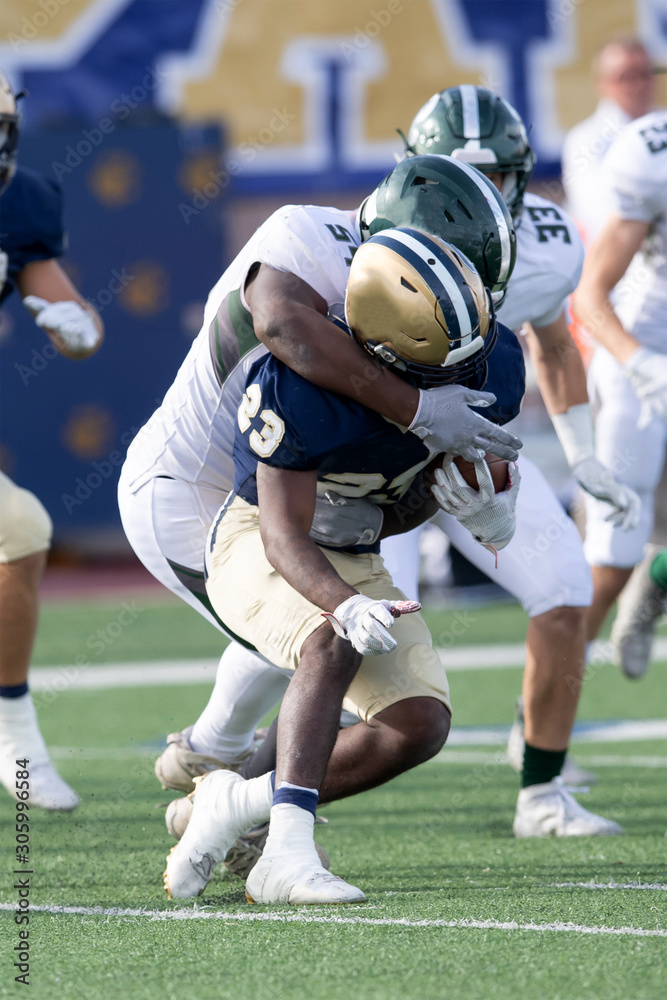 Action photos of high school football players making amazing plays during a football game Action photos of high school football players making amazing plays during a football game
