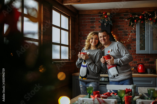 husband and wife drink tea in the kitchen