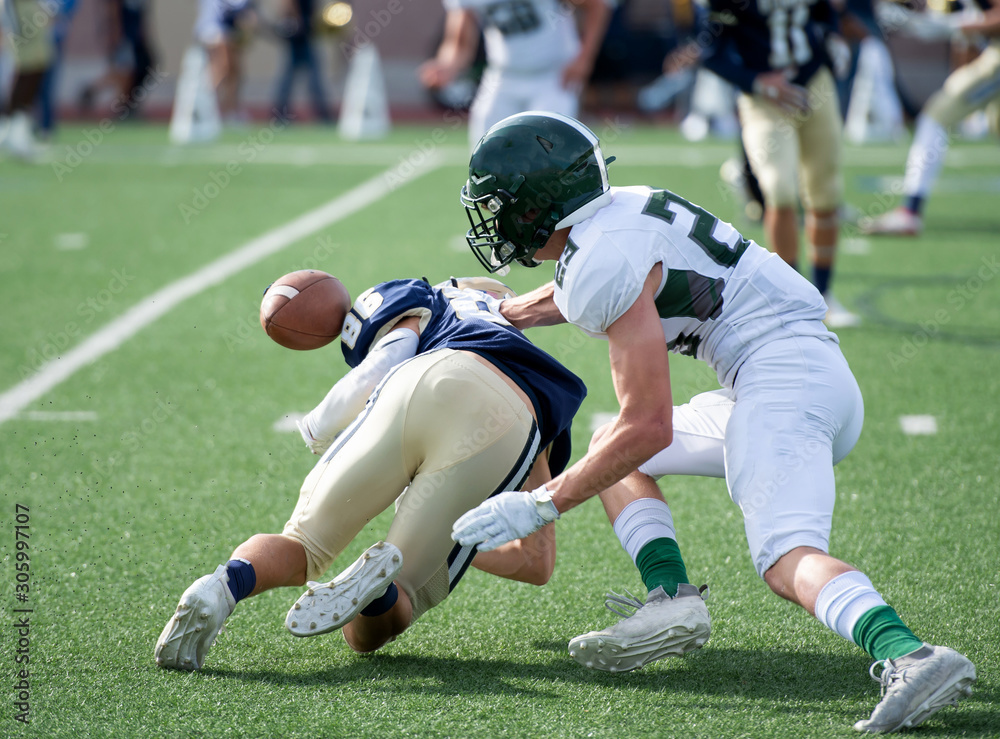 Action photos of high school football players making amazing plays during a football game Action photos of high school football players making amazing plays during a football game