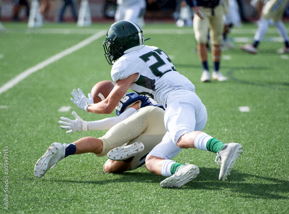 Action photos of high school football players making amazing plays during a football game Action photos of high school football players making amazing plays during a football game