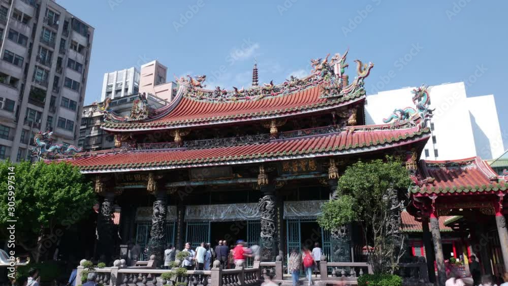 Worshipers at Longshan Temple. The temple was originally built by Fujianese settlers in 1738. 4K hyperlapse Worshipers at Longshan Temple. The temple was originally built by Fujianese settlers in 1738. 4K hyperlapse