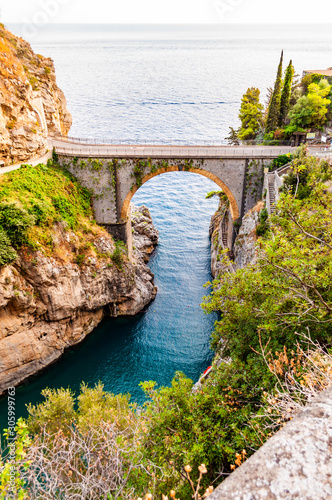 Valokuva View on Fiordo di Furore arc bridge built between high rocky cliffs above the Tyrrhenian sea bay in Campania region