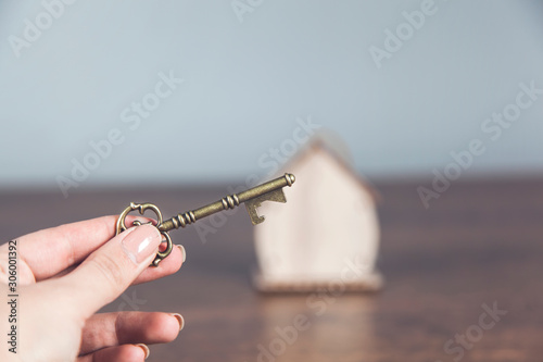 woman hand key with house model