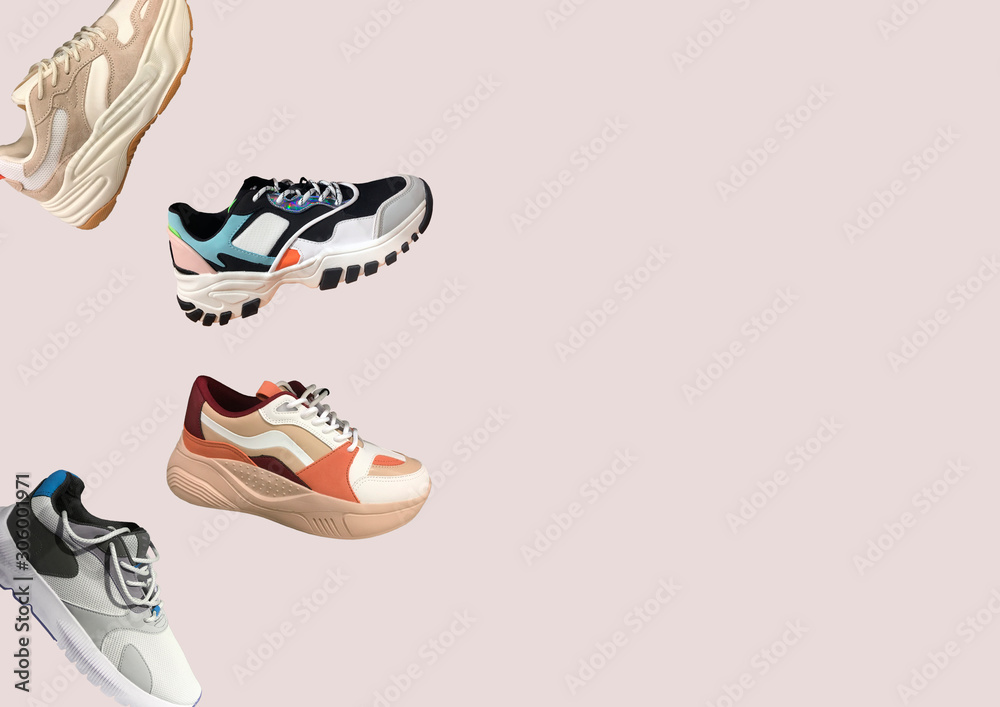 Platform sneakers with bright color accents pattern on pink background.  Close View Of Fashion Casual Sneakers with Shoelaces. High Platform Sneakers  For Women. Composition of Fashion Casual sneakers Stock Photo | Adobe
