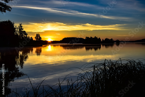 Golden sunrise over the water, Latvia.