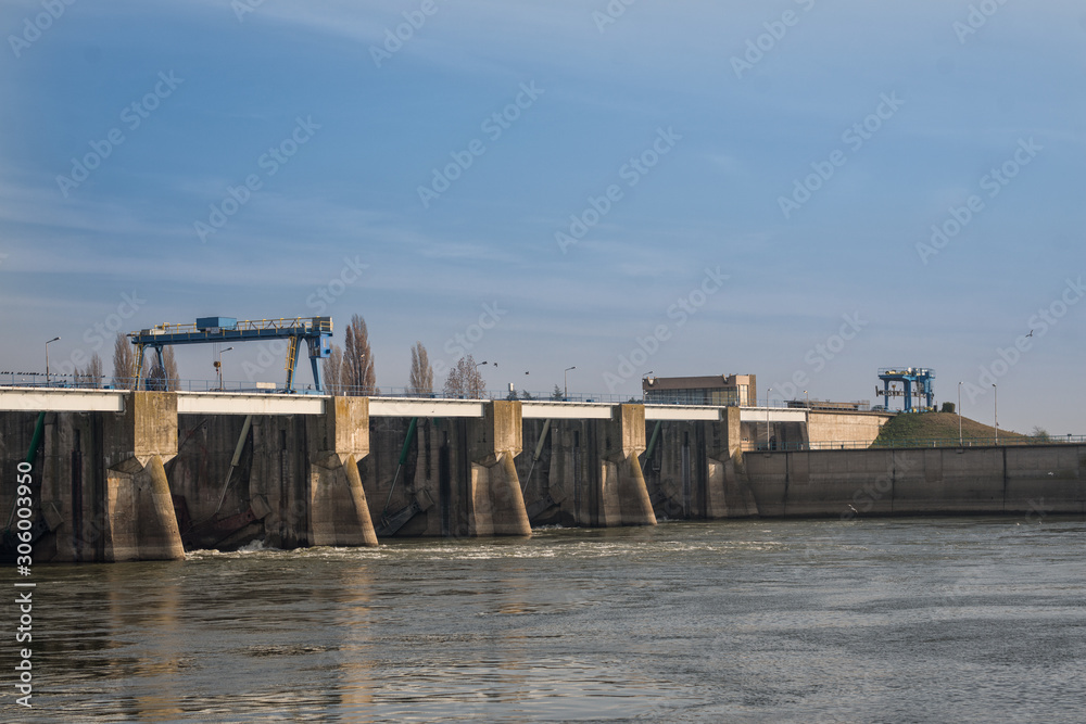 Dam on the river. Winter day on the river Dam on the river. Winter day on the river