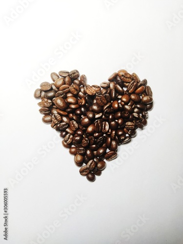 heart made of coffee beans on white background