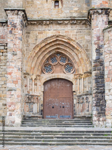 Stone arch in the door of a church in Castro Urdiales, Spain