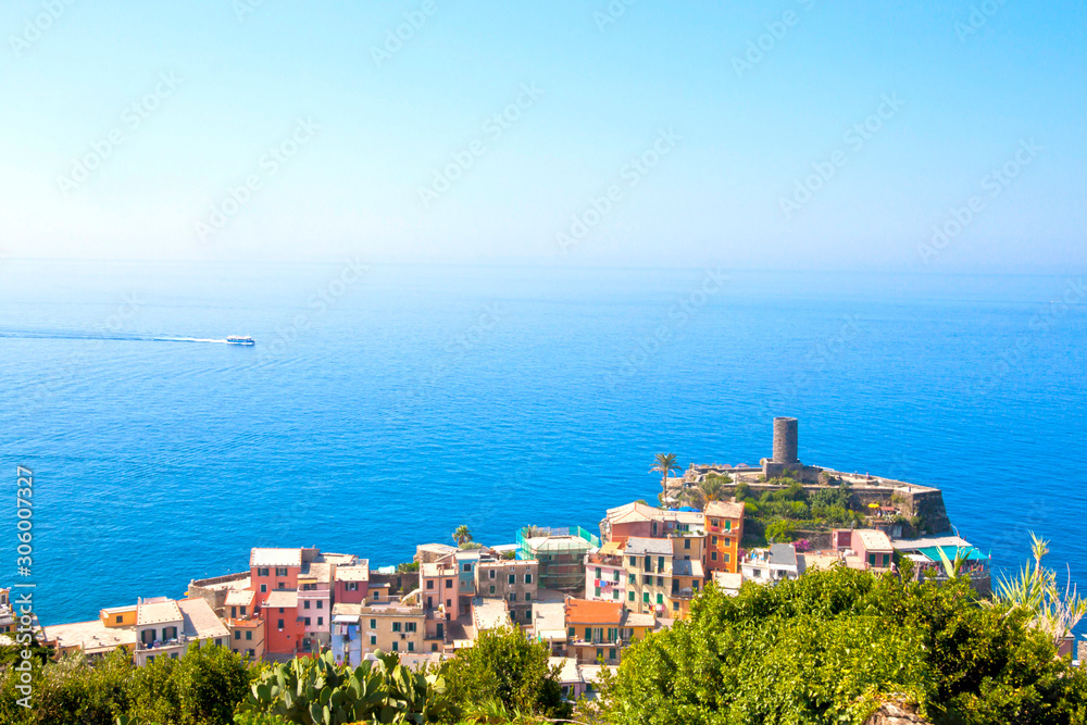 Monterosso a village from the cinque terre with its houses and the sea with a boat