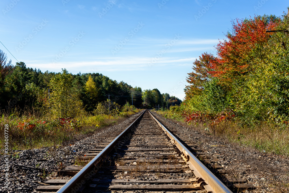 Railway tracks in a rural scene in nice autumn sunny day