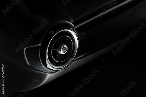 Air condition vent  for adjust airflow in a passenger room of car with a circle shape, automotive part concept. © BLKstudio
