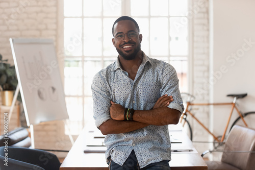 Smiling confident african american young businessman portrait.