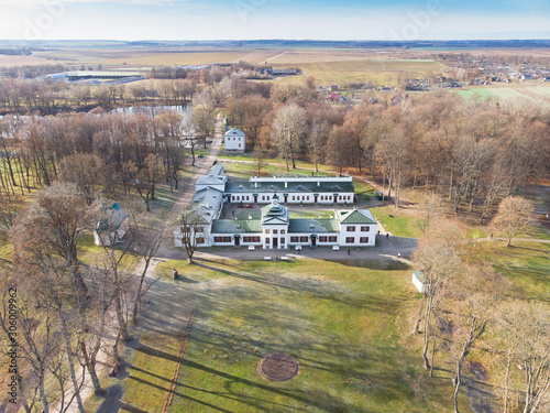 Autumn in the park, park buildings. Well maintained garden. Manor and park of the famous Russian composer Oginsky. Travel in Belarus. Drone view. Background. photo