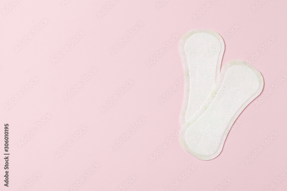 Two pads on a pink background. Ovulation concept. menstruation concept. Two pads on a pink background. Ovulation concept. menstruation concept.