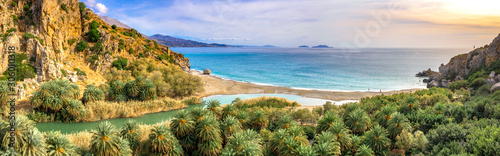 Panorama of Preveli beach at Libyan sea, river and palm forest, southern Crete , Greece photo