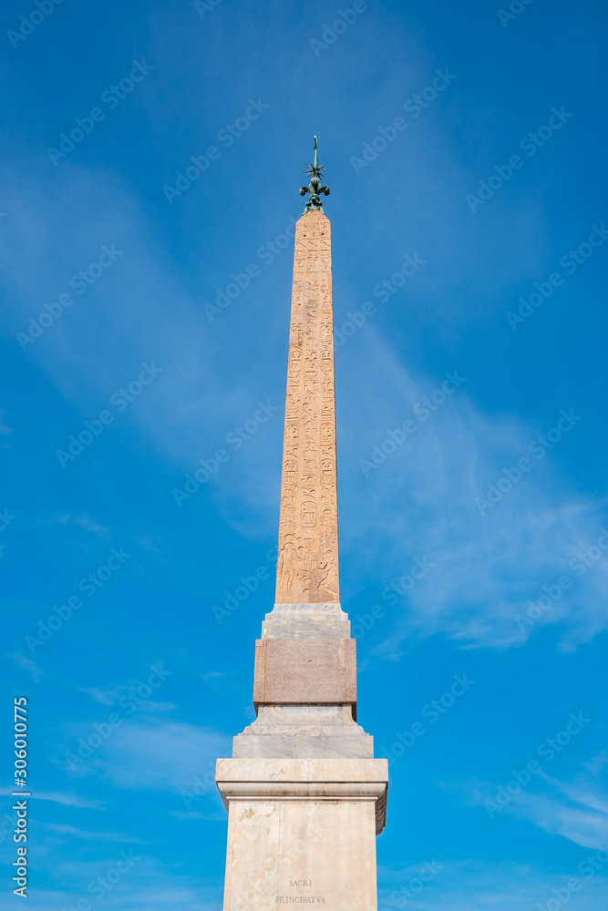 Ancient Egyptian obelisk in front of Santissima Trinita dei Monti church in rome. Italy.