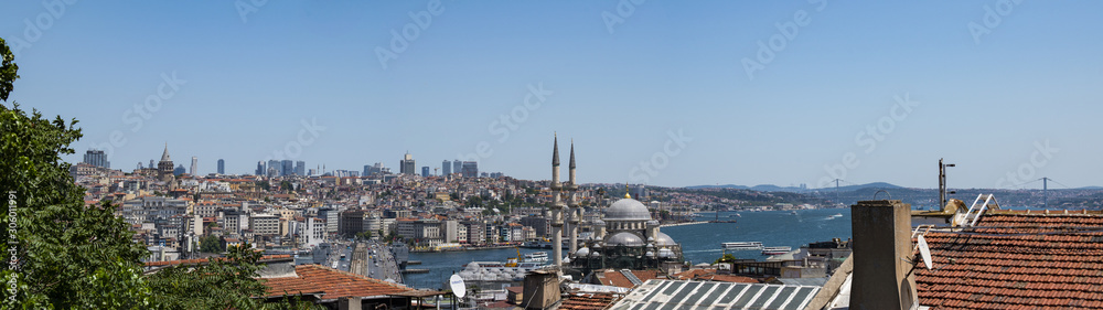 Istanbul, Turkey, Middle East: a breathtaking and panoramic view of the skyline of the city with its roofs, mosques, minarets and the Bosphorus, the Strait of Istanbul, seen from the Bazaar District 