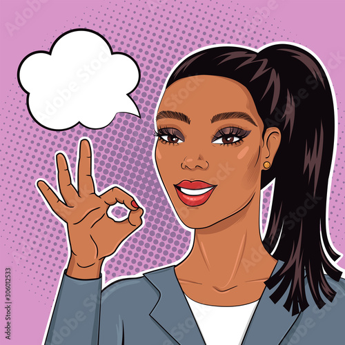 Pop art african american business woman in suit smiling and showing Ok sign with speech bubble for your message, vector illustration in retro comic style