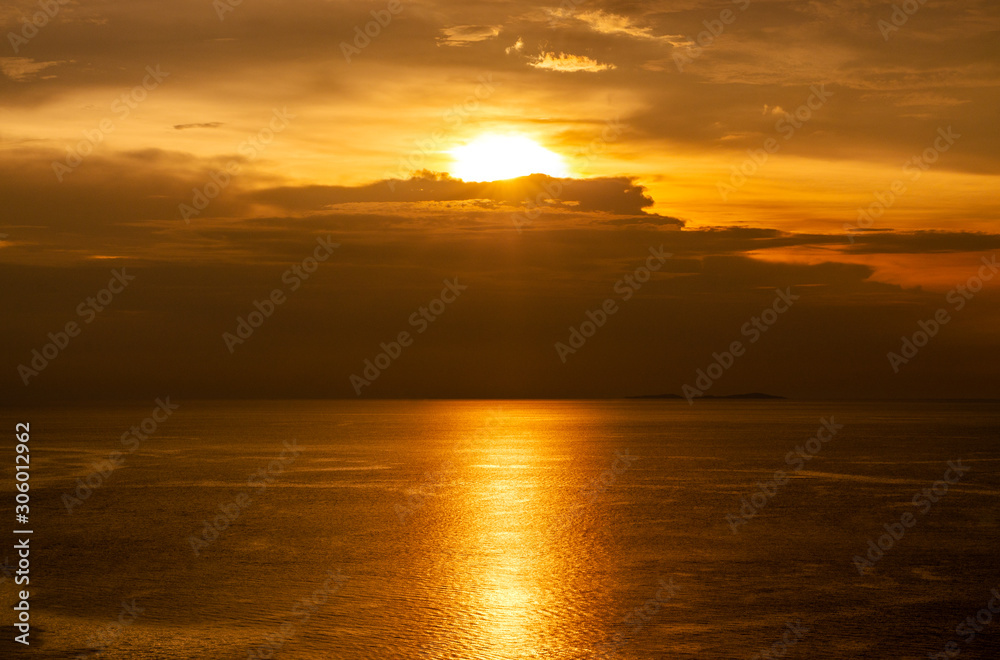 Beauty Sunset over the sea. The beautiful reflection of the sunset on the sea surface.