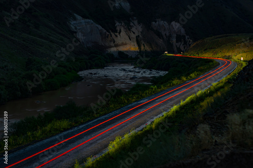 Painting with light at night. The trail left behind by a car that broke into the darkness.