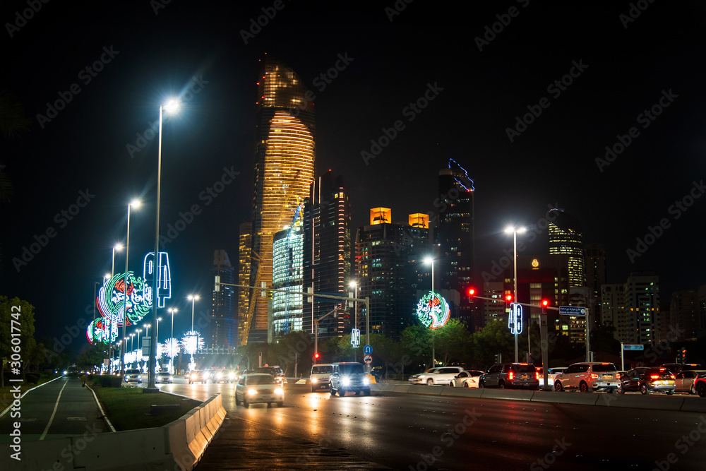 Abu Dhabi downtown Corniche road decorated for the UAE national day celebration at night