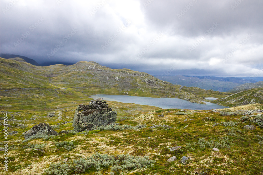 Fototapeta premium blac clouds over Sognefjellet mountain road in Norway