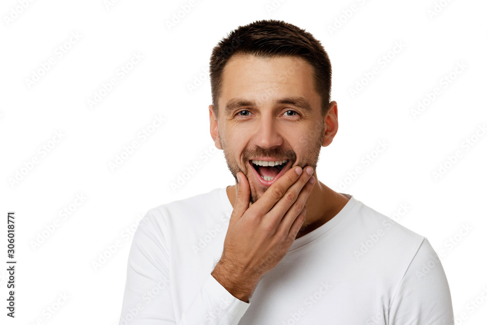 Close-up portrait of smiling handsome bearded man in white shirt looking at camera isolated on white background Close-up portrait of smiling handsome bearded man in white shirt looking at camera isolated on white background