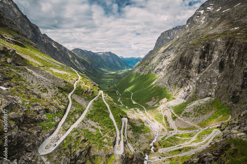 Trollstigen, Andalsnes, Norway. Cars Goes On Serpentine Mountain Road Trollstigen. Famous Norwegian Landmark And Popular Destination. Norwegian County Road 63 In Summer Day photo