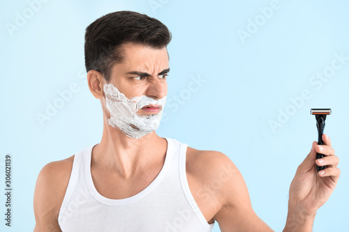 Displeased young man with r...