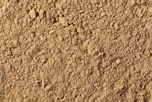 Ginger powder background and texture, top view