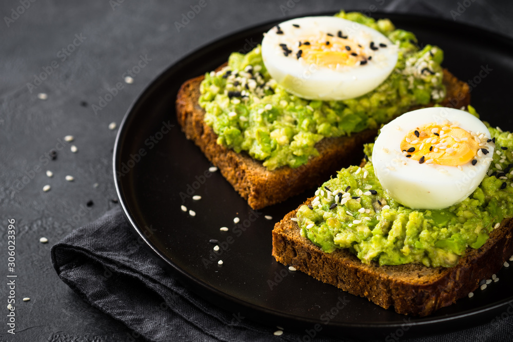Avocado Sandwiches on black background. Avocado Sandwiches on black background.
