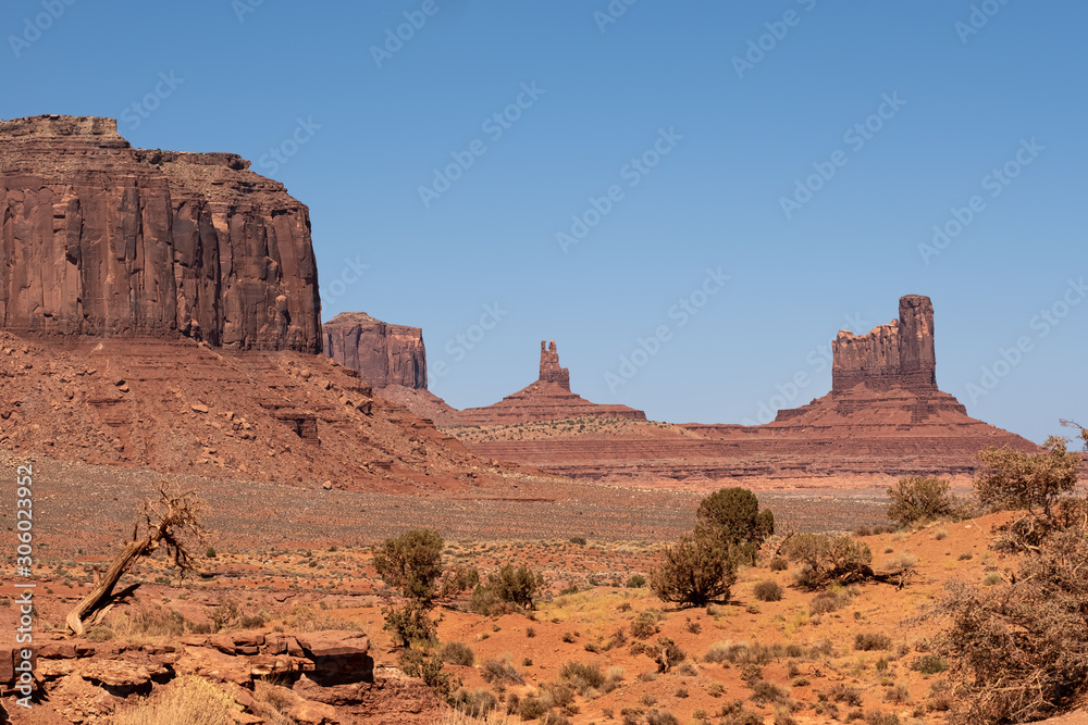 Monument Valley region of the Colorado Plateau with vast sandstone buttes on the Arizona–Utah border, in a Navajo Nation Reservation. USA Monument Valley region of the Colorado Plateau with vast sandstone buttes on the Arizona–Utah border, in a Navajo Nation Reservation. USA