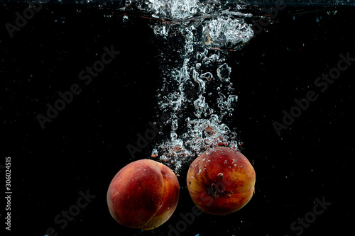 fresh pair of peaches in the water