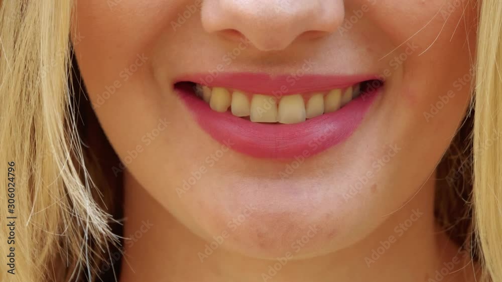 Smiling female mouth with natural color of teeth. Close up of smiling woman face with perfect smile. Smiling female mouth with natural color of teeth. Close up of smiling woman face with perfect smile.