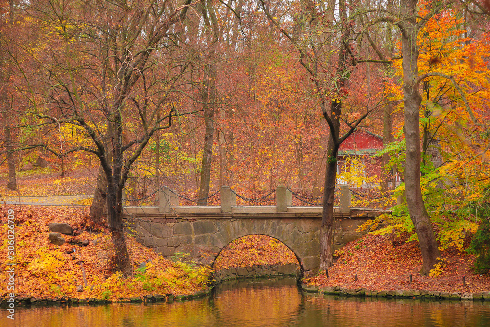 Stone bridge in autumn park Stone bridge in autumn park