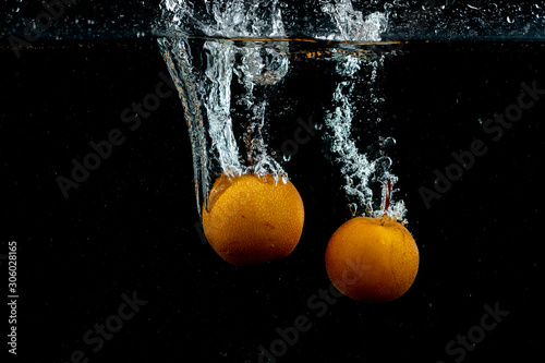 fresh oranges in the water __