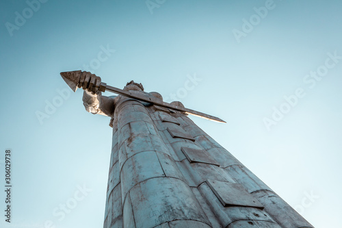 Kartlis Deda (Mother of Georgia) Monument on top of Sololaki hill overlooking Tbilisi city center over turquoise sky