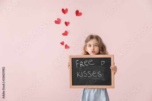 Cute little girl holding ch...