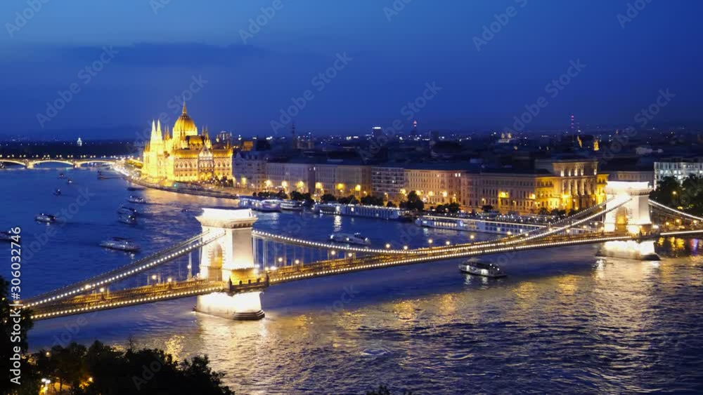 dusk shot of chain bridge, danube river and the city of budapest, hungary dusk shot of chain bridge, danube river and the city of budapest, hungary