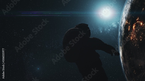 Astronaut man silhouette against realistic Earth. Back view of spaceman in deep space. Sun appear out of illuminated planet surface. 3d animation. Science concept. Elements of media furnished by NASA