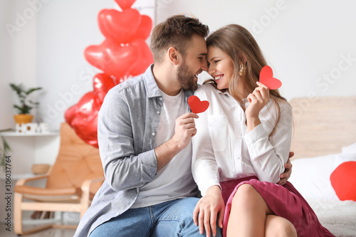 Happy young couple celebrat...